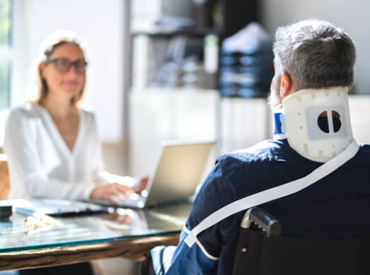 Injured worker meeting with lawyer.